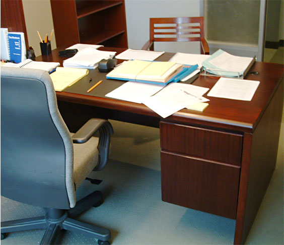 This office desk was repaired and refinished on-site by Billings Woodworking